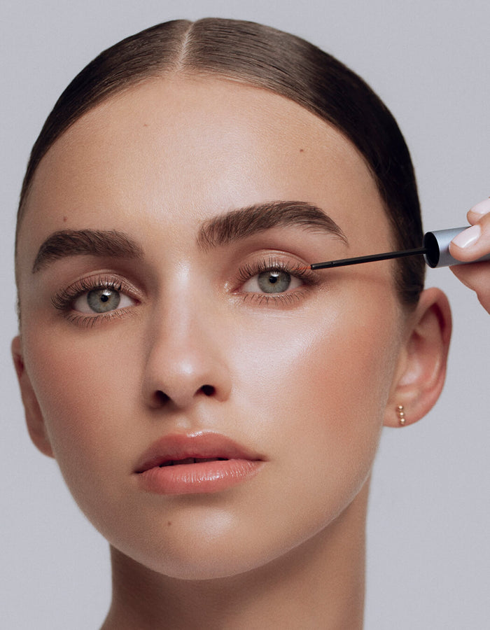 Model applying sensitive lash serum